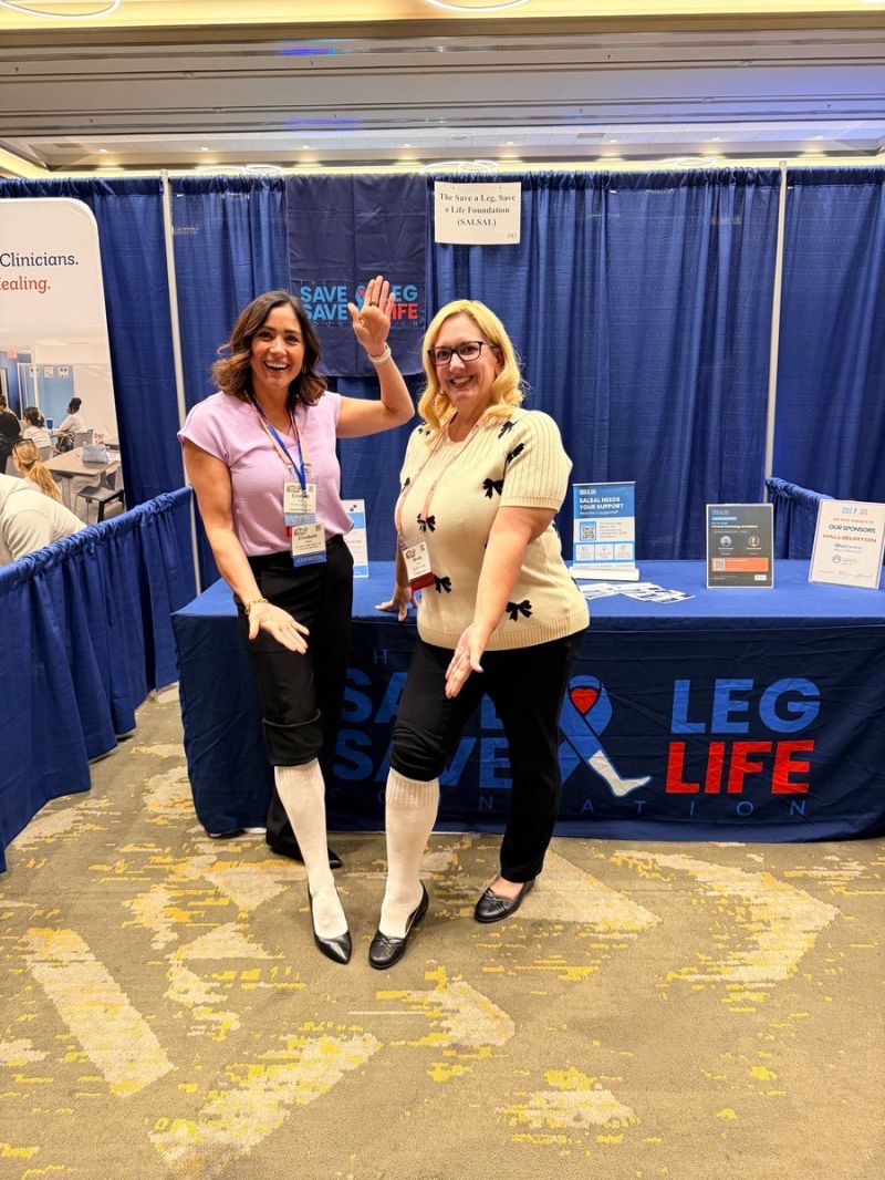 SALSAL supporters wearing white socks at the SALSAL booth at the HEAL conference