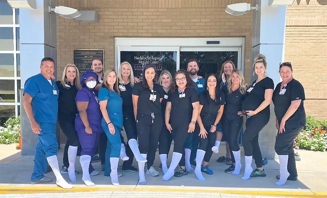 Care team wearing white socks for the campaign